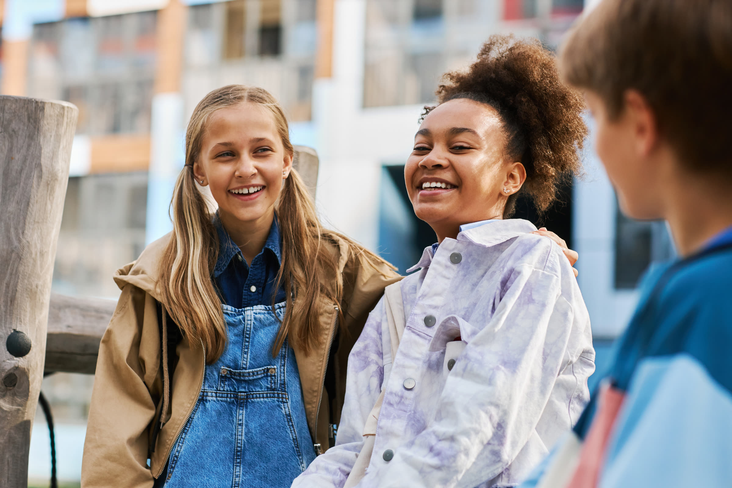 Children smiling together outdoors